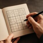 A challenging sudoku puzzle with numbers partially filled in.